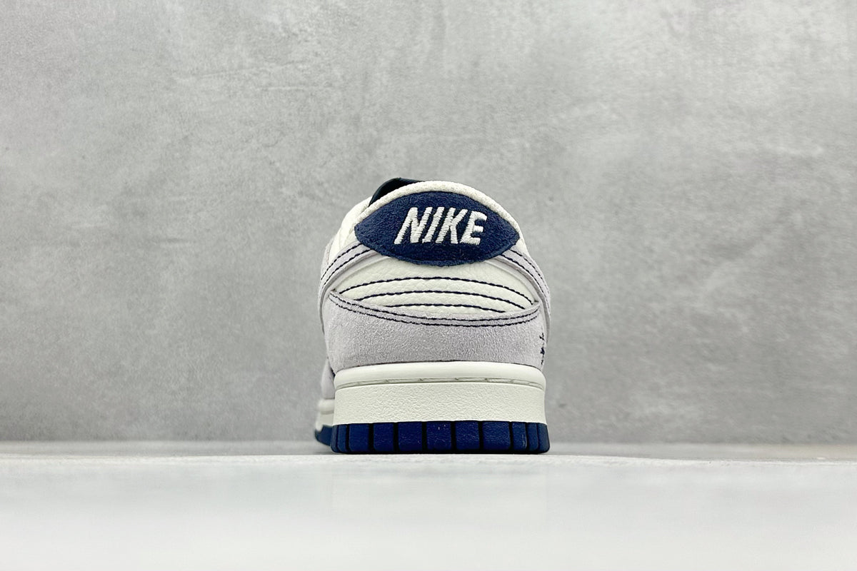 Nike SB Dunk Low x Stüssy - Navy Blue / White